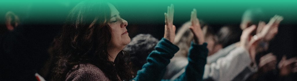 Woman praising at Church of the Valley in Chicopee, Pioneer Valley MA
