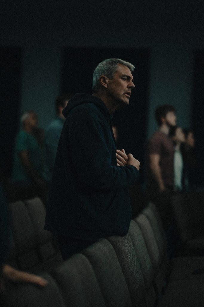 Man with arms crossed worship in the Pioneer Valley