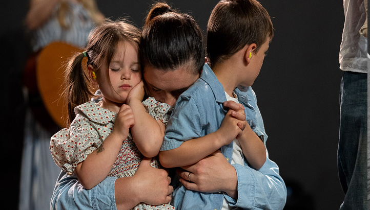 Mother huggin her kids at Church of the Valley in Chicopee, MA